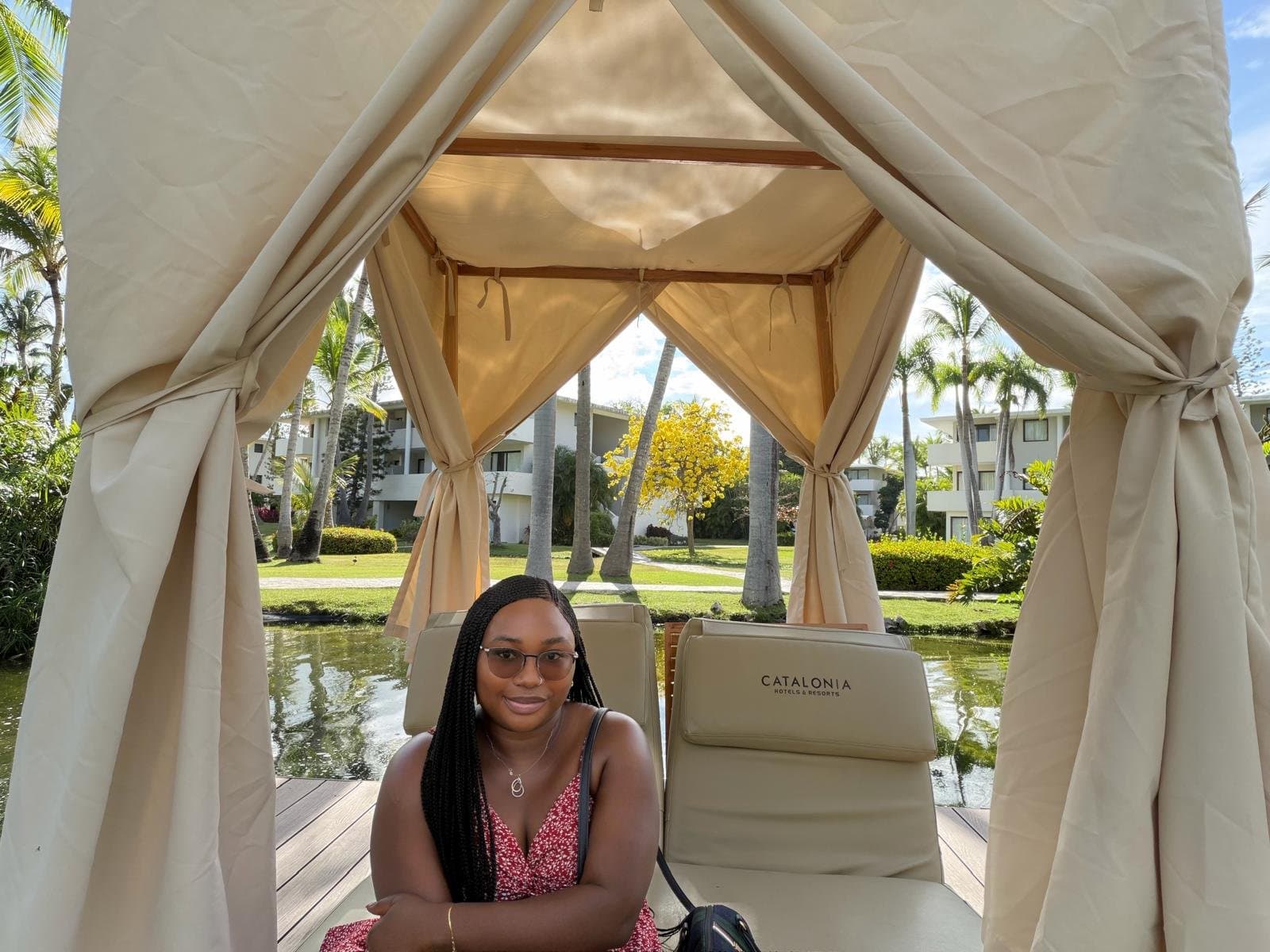 Hydee relaxing in a poolside cabana